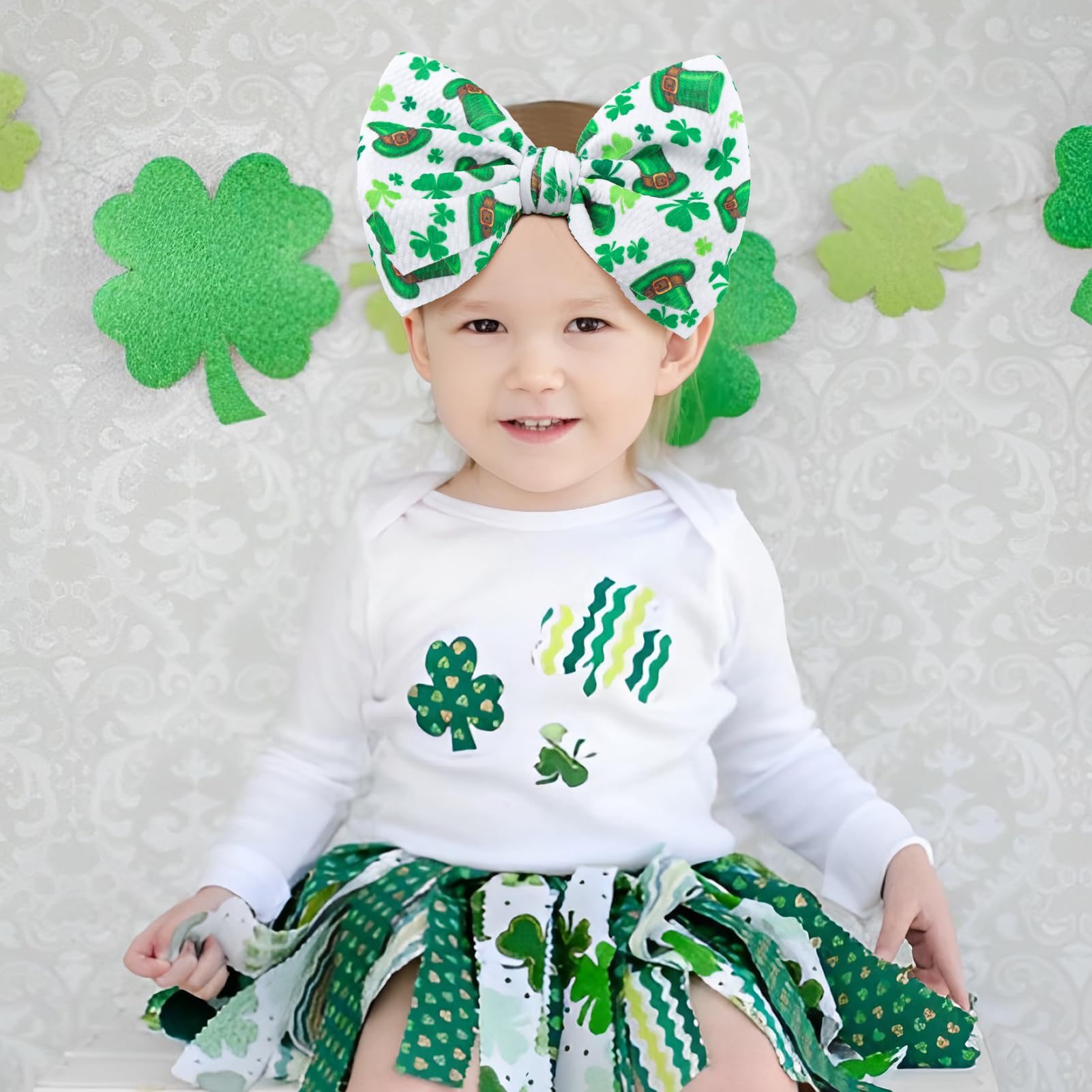 Lanmerry green shamrock bow on elastic headband for comfortable wear.