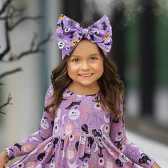Lanmerry skull-pattern bow; playful spooky detail for outfits.