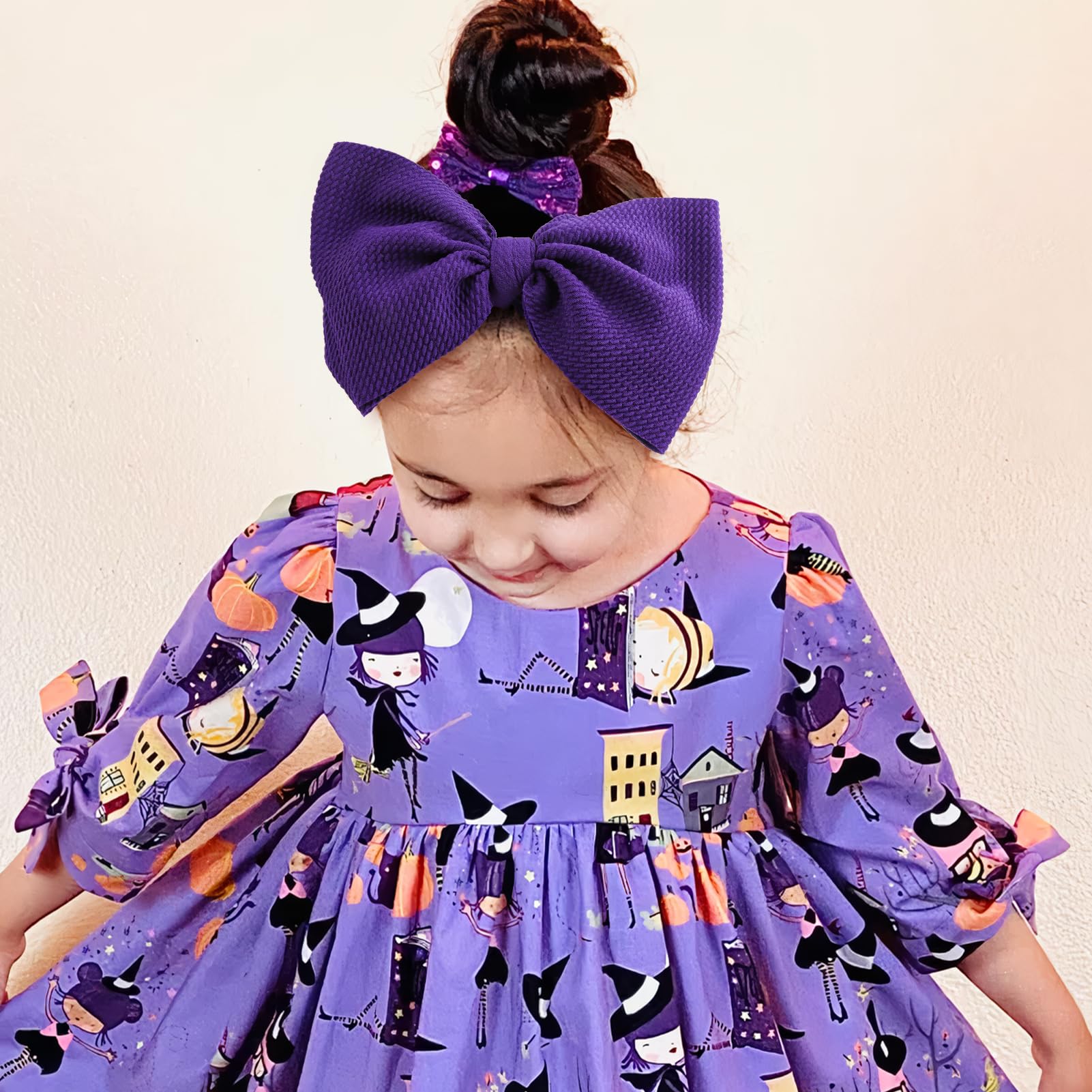Lanmerry skull-pattern bow adds playful style to baby's Halloween outfit.