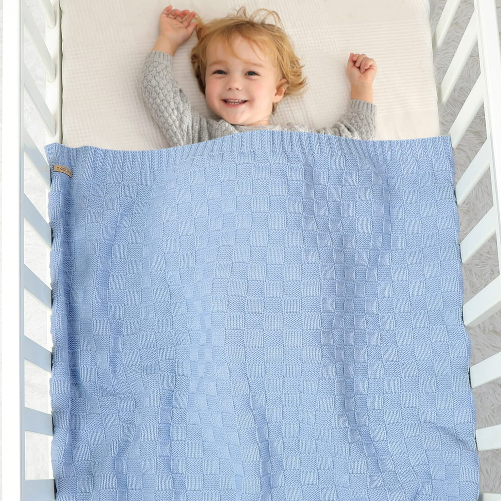 LAWKUL Checkered Knit Blanket full view highlights timeless pattern and nursery compatibility.