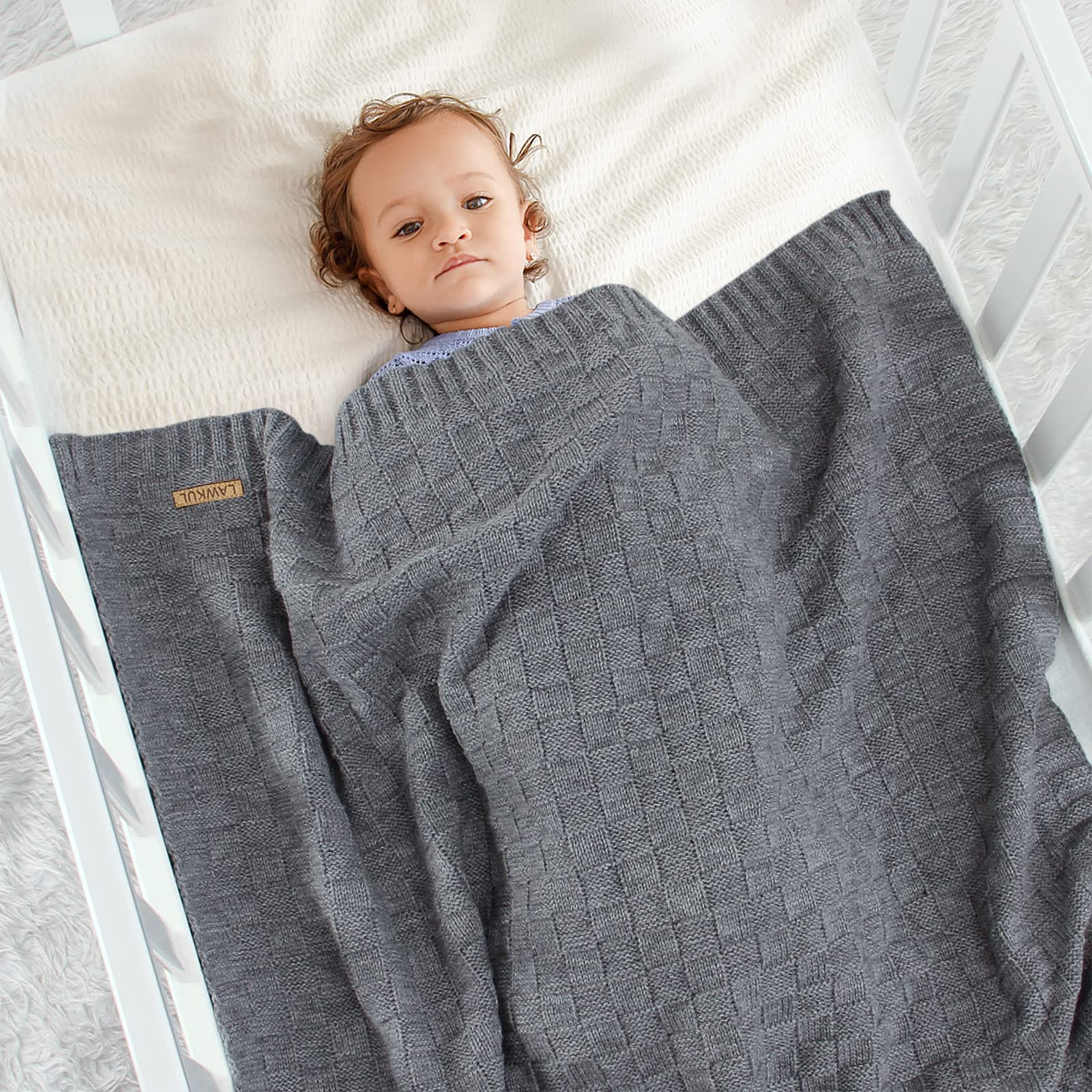 LAWKUL Checker-pattern cable knit showing color options for playful nursery styling.
