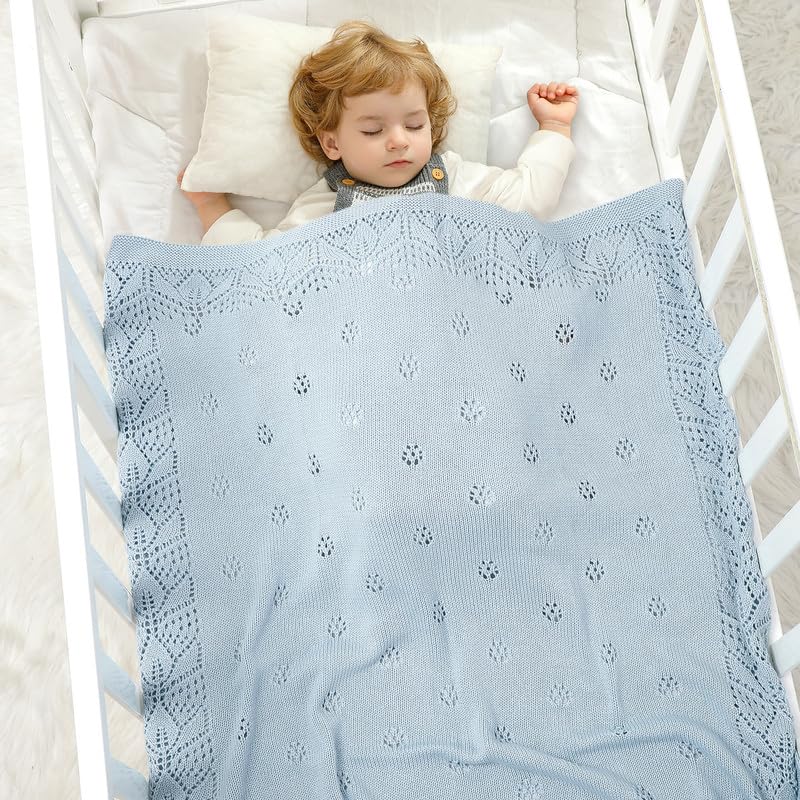LAWKUL knitted pattern blanket highlights delicate cellular design for newborns.