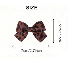 LDDCX fabric bow detail provides soft, secure accessory for little girls.