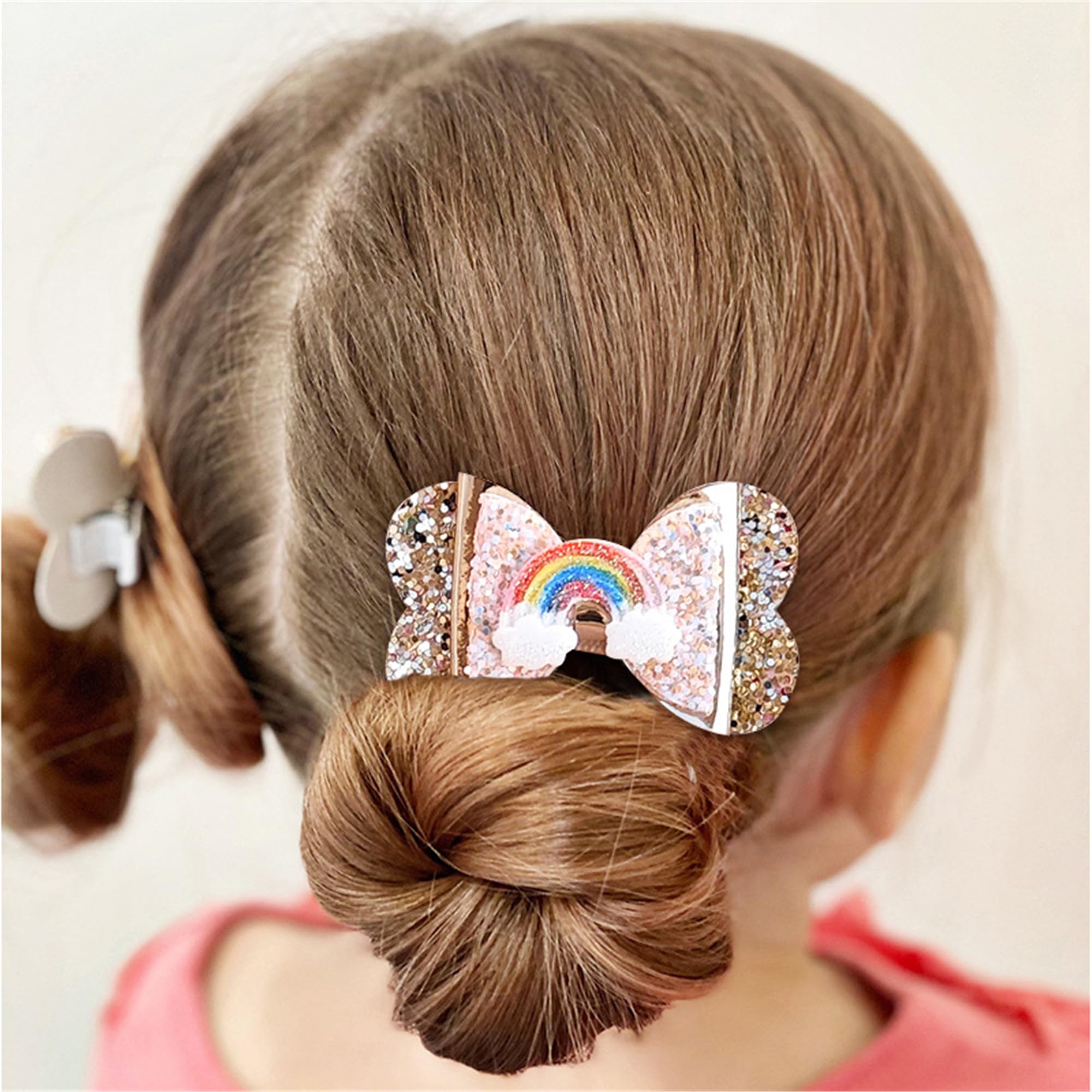 LDDCX glitter gold bows hair clip worn with dresses for photoshoots.