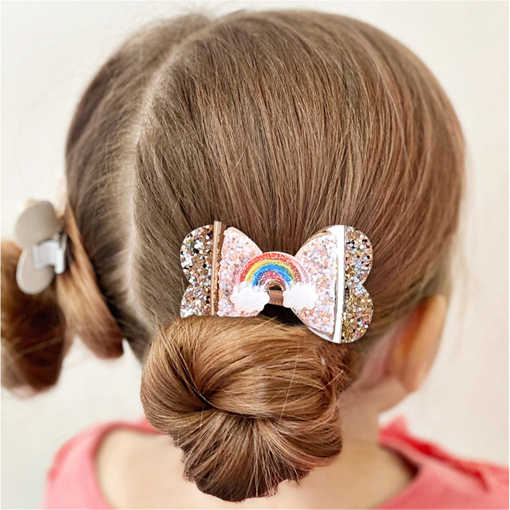 LDDCX glitter gold bows hair clip worn with dresses for photoshoots.