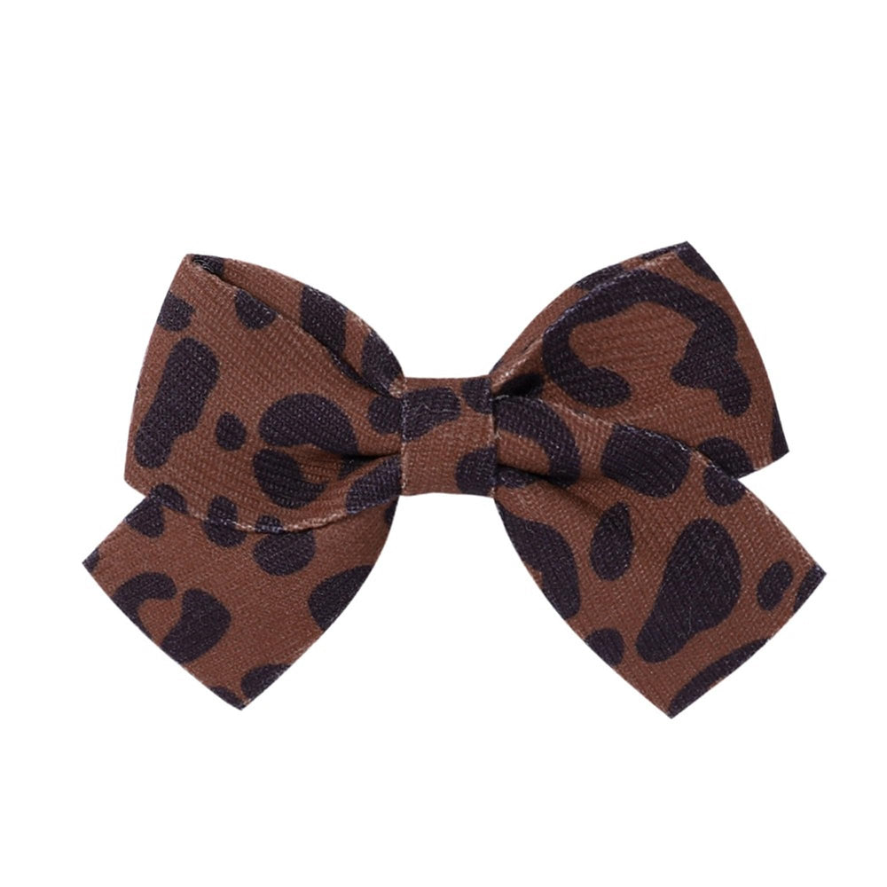LDDCX leopard-print bow hairpin enhances party-ready looks.