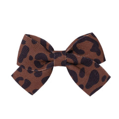 LDDCX leopard-print bow hairpin enhances party-ready looks.