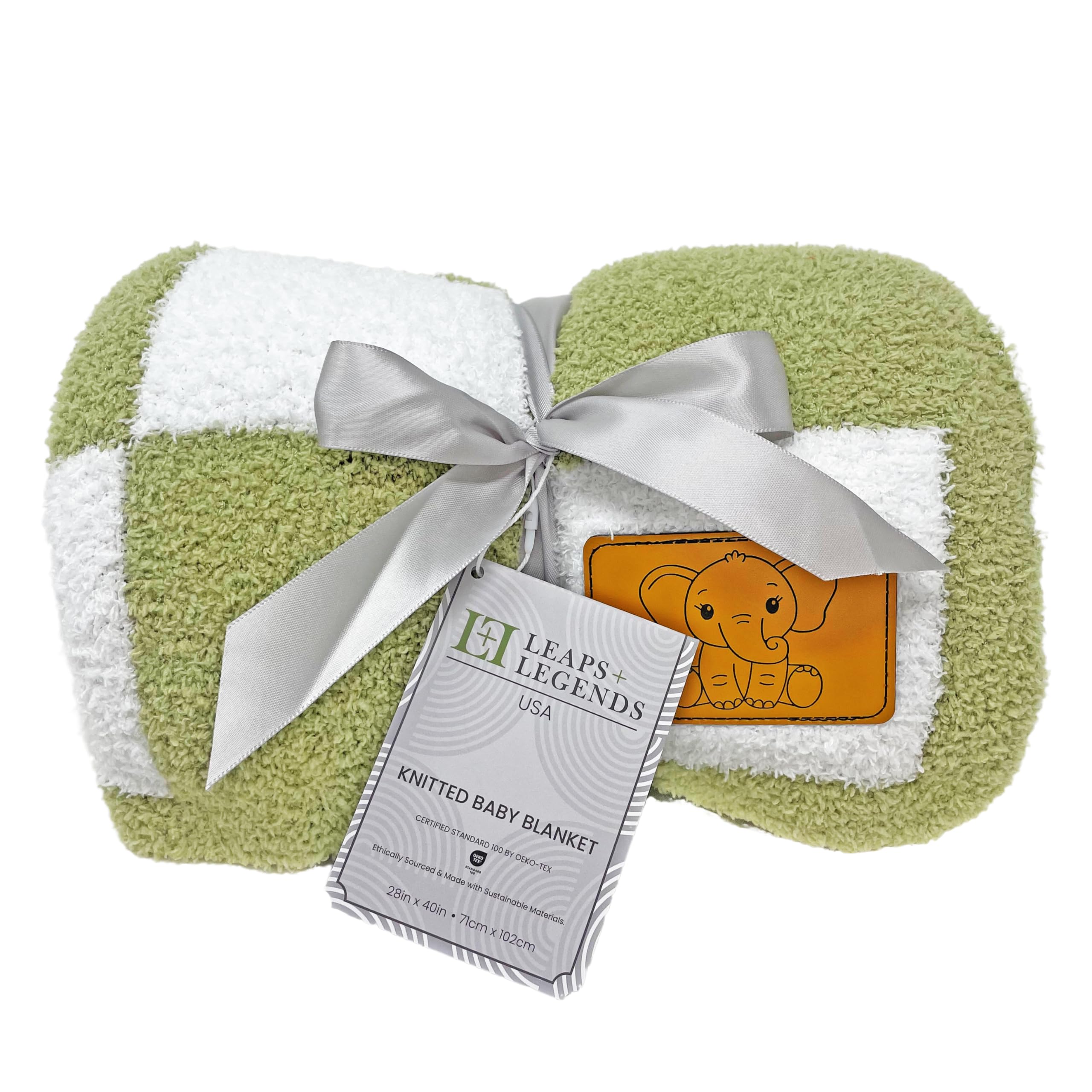 Blanket laid in a crib illustrating generous 28x40 coverage.