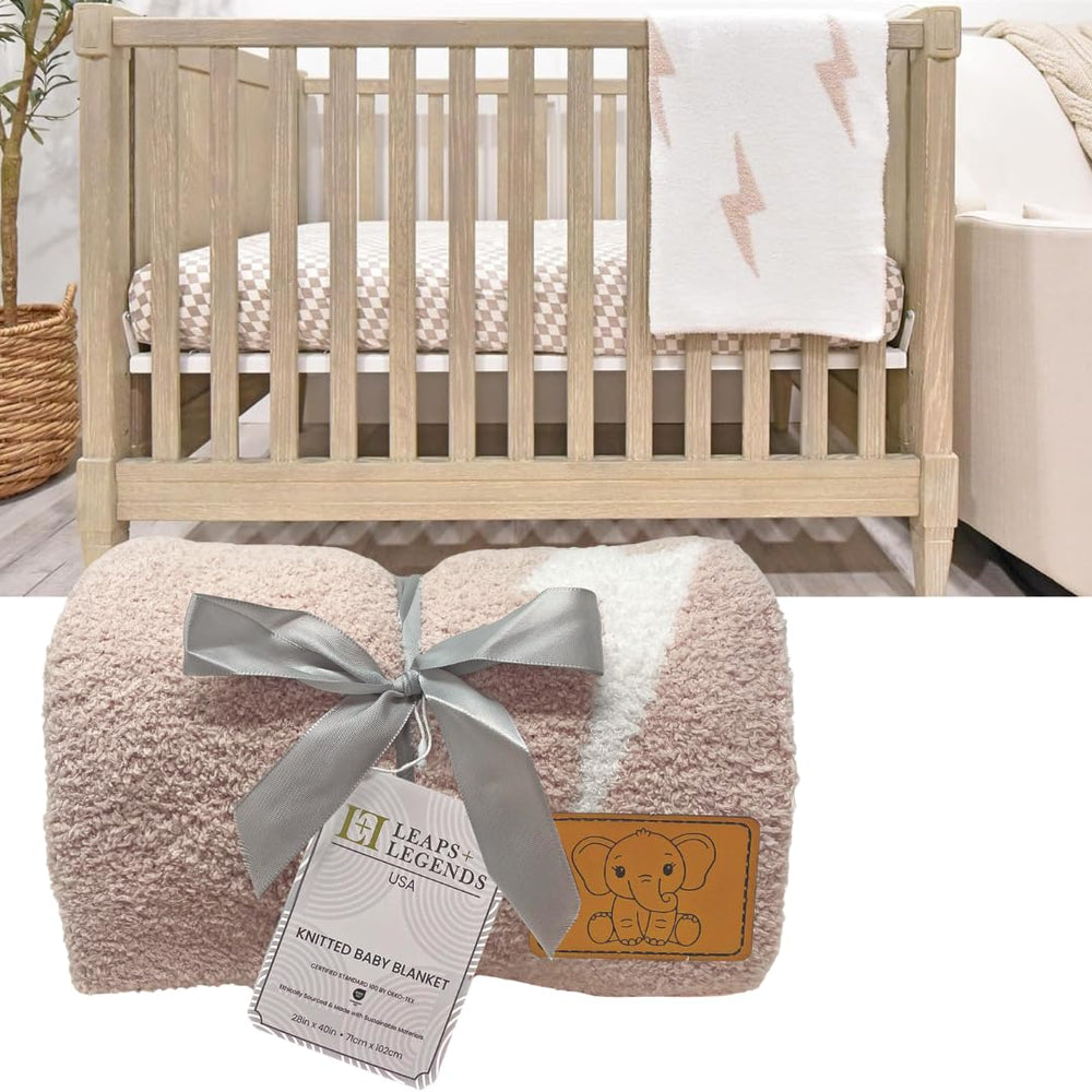 Leaps + Legends Lightning Bolt blanket draped on a crib for cozy newborn warmth.