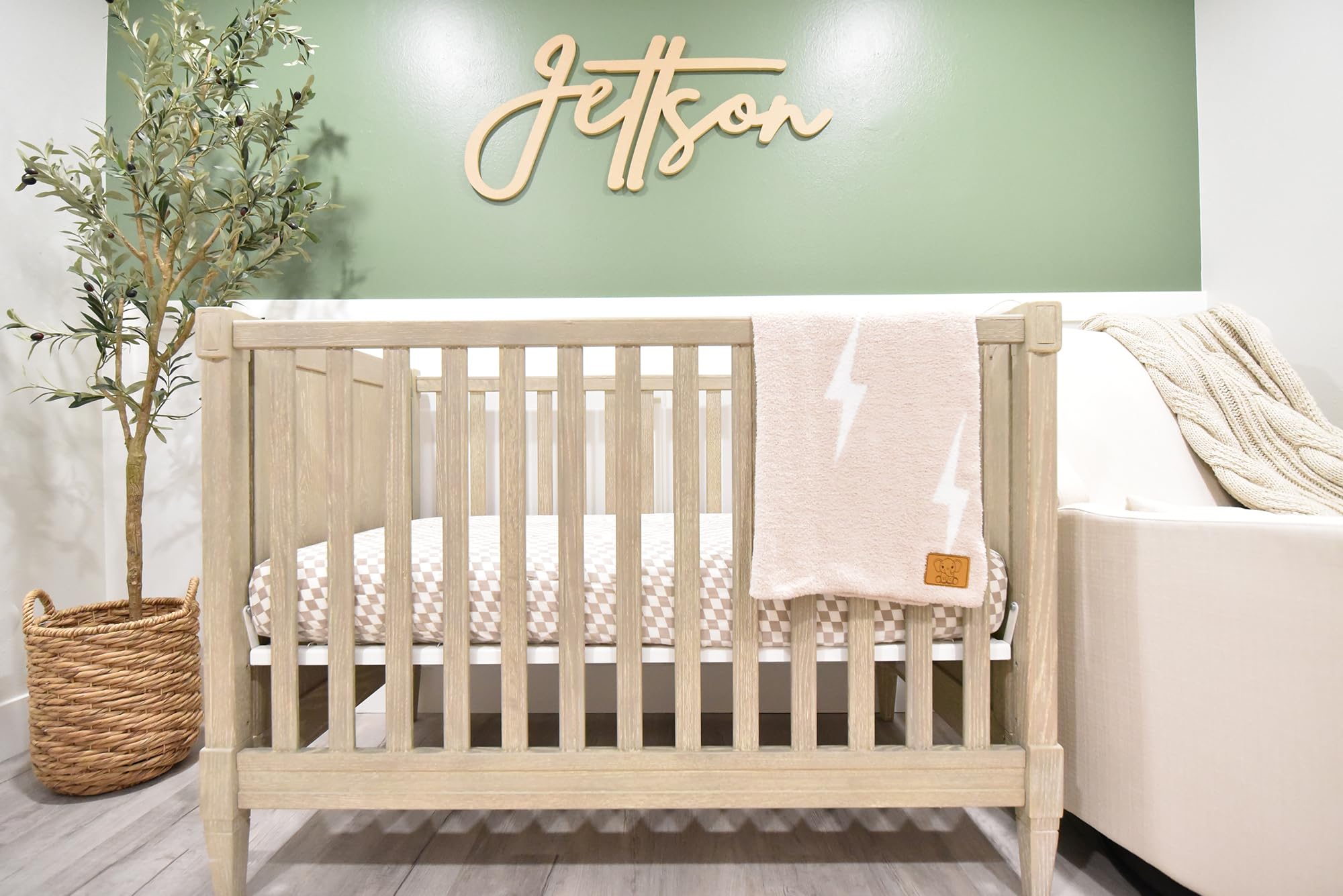 Leaps + Legends Tan/White Lightning Bolt blanket complements nursery decor.