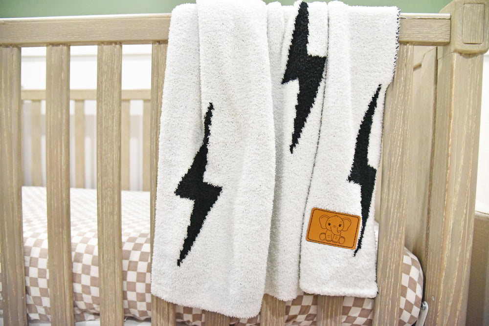 Leaps + Legends lightning bolt blanket leather patch detail and durable stitching.