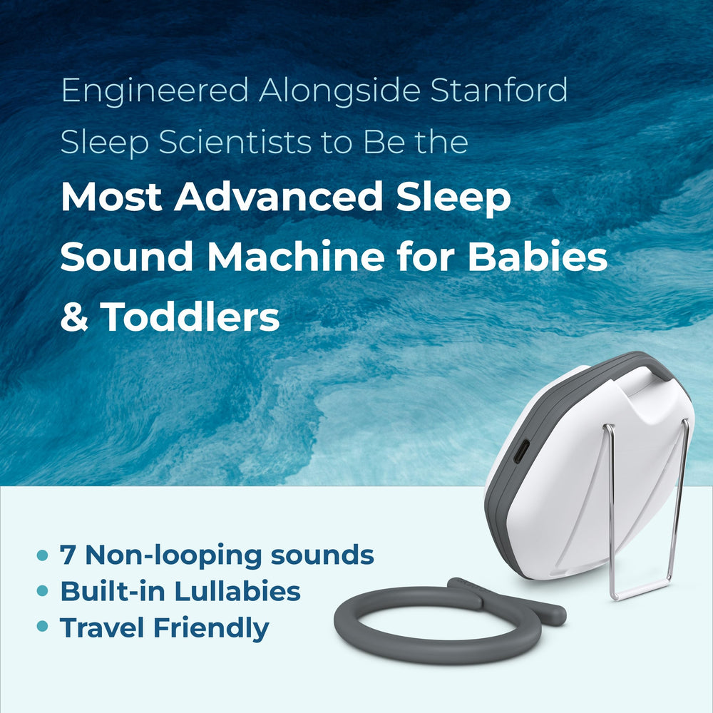 LectroFan Alpha beside a crib delivering calming non-looping sounds for naps.