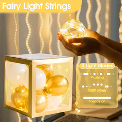Ledido baby boxes inside with balloons and fairy lights create a warm party centerpiece