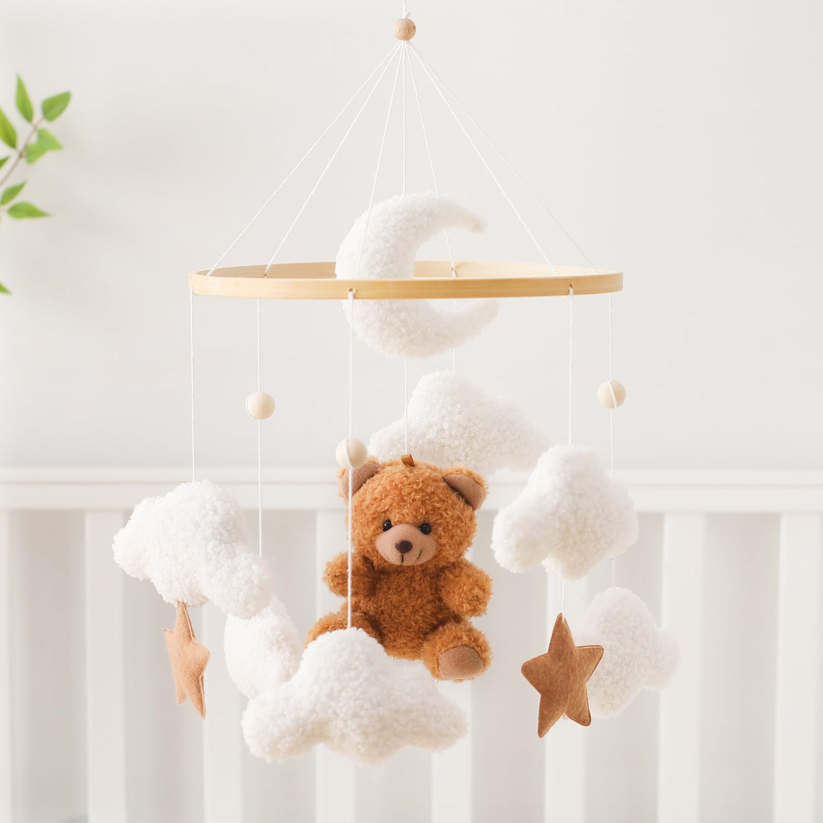 Let's Make Bear Cloud baby mobile on crib creates a cozy nursery atmosphere.