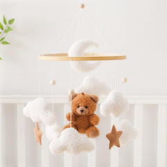 Let's Make Bear Cloud baby mobile on crib creates a cozy nursery atmosphere.