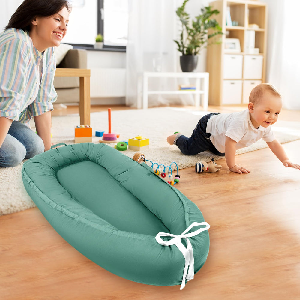 Letwearn baby lounger cover with built-in carry handle for quick movement.