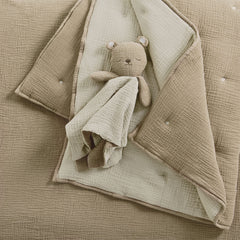Levtex Baby Cloud Muslin swaddle in beige for secure, gentle swaddling.
