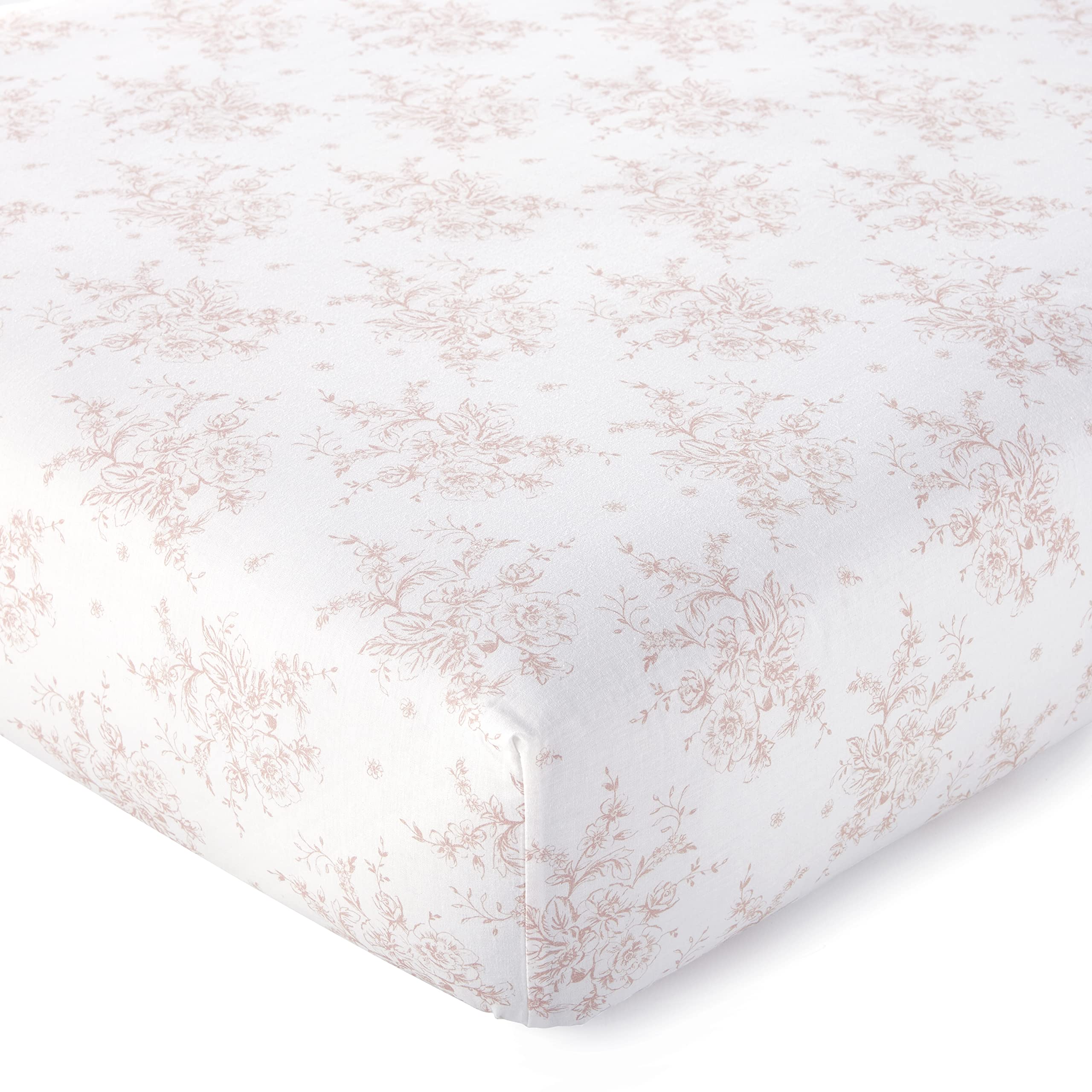 Levtex Baby Heritage crib fitted sheet in floral blush on white, snug fit for standard crib mattresses.