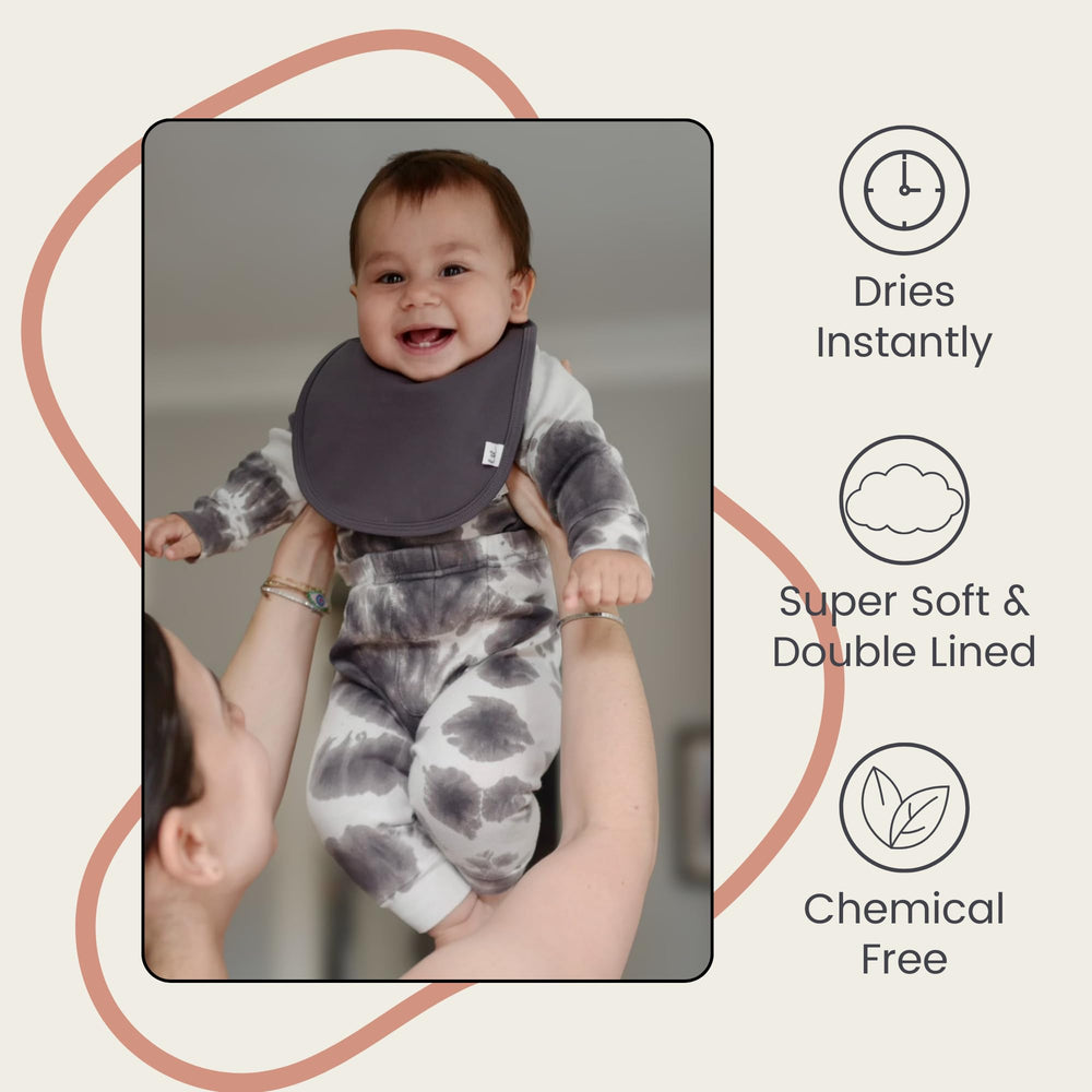 Leya & Lior StayDri bib adjustable snaps for a growing baby.