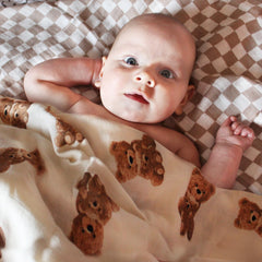 LifeTree muslin swaddle with checkered pattern provides soft, breathable wrap for soothing baby.