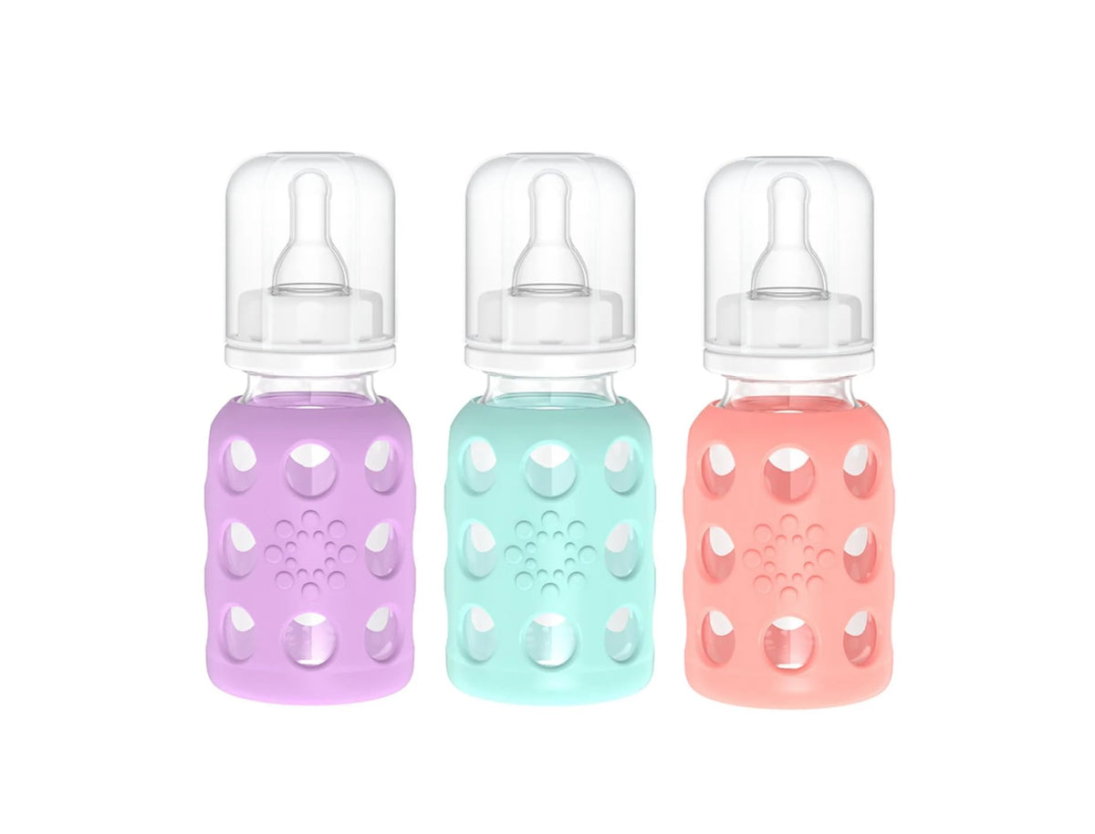 Lifefactory 4oz glass baby bottle with lavender silicone sleeve, easy to grip and clean.