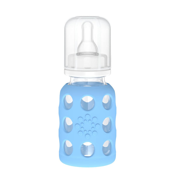 Lifefactory 4-Oz sky blue glass baby bottle with silicone sleeve offering secure grip.
