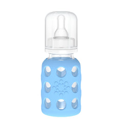 Lifefactory 4-Oz sky blue glass baby bottle with silicone sleeve offering secure grip.