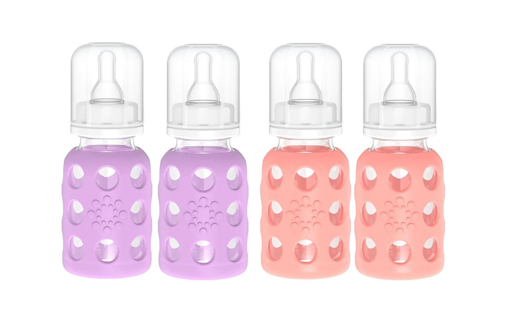Lifefactory glass baby bottle with lavender silicone sleeve for easy grip.
