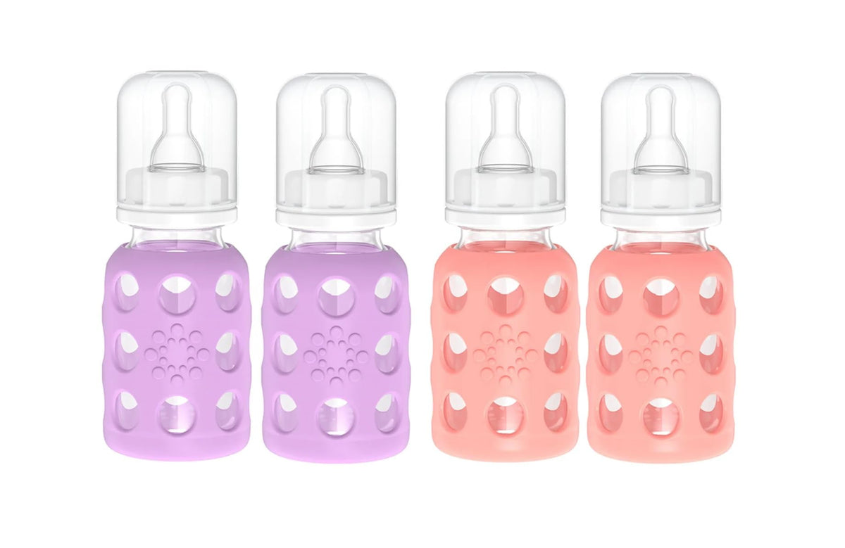Lifefactory glass baby bottle with lavender silicone sleeve for easy grip.