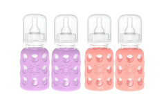 Lifefactory glass baby bottle with lavender silicone sleeve for easy grip.