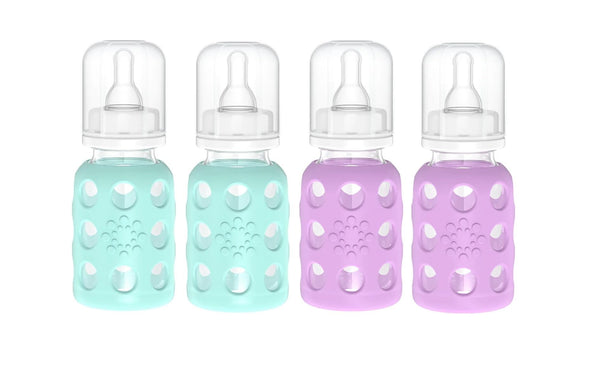 Lifefactory glass baby bottle with mint silicone sleeve for easy gripping and feeding.