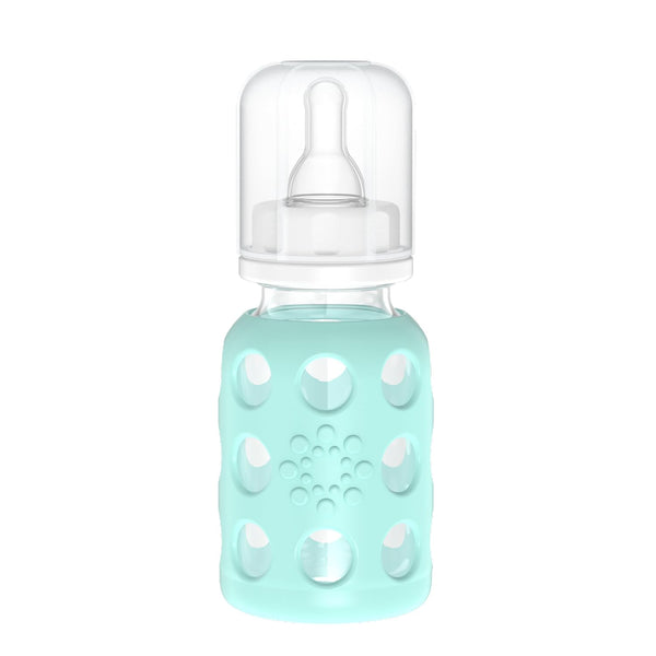Lifefactory glass baby bottle with mint sleeve for secure grip.