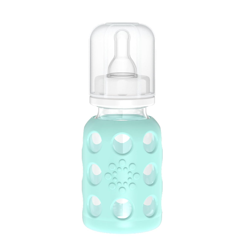 Lifefactory glass baby bottle with mint sleeve for secure grip.