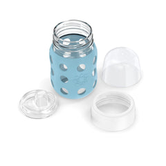 Lifefactory silicone sleeve and grip support one-handed feeding.
