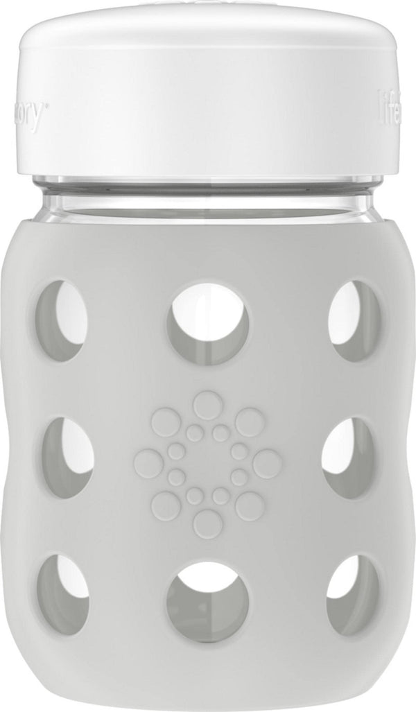 Lifefactory wide-neck baby bottle with silicone sleeve for easy grip and safe handling
