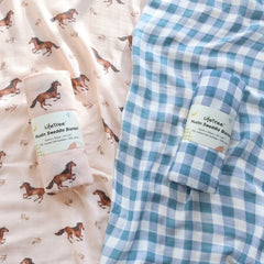 LifeTree swaddle blanket in blue checkered pattern offers breathable style for calm swaddling.