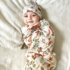 LifeTree muslin swaddle featuring raccoon print, breathable fabric ideal for warm evenings
