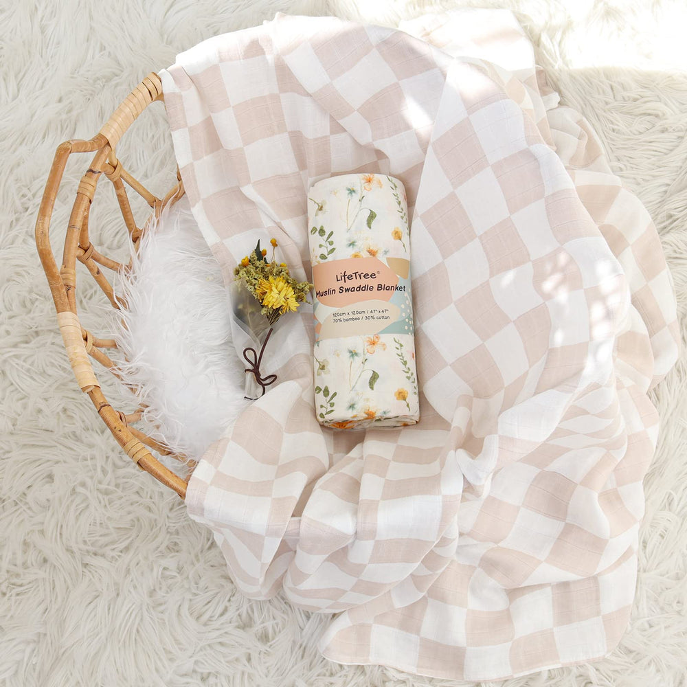 LifeTree muslin swaddle multiuse blanket used as prop or cover.