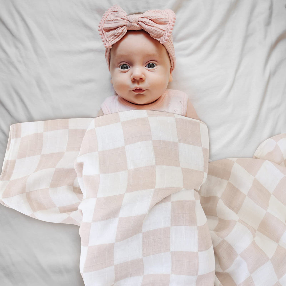 LifeTree muslin swaddle newborn snug wrap in action.