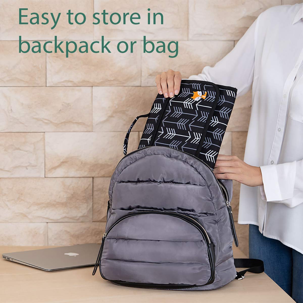 Lil Fox diaper clutch strap attaches to stroller for hands-free use.