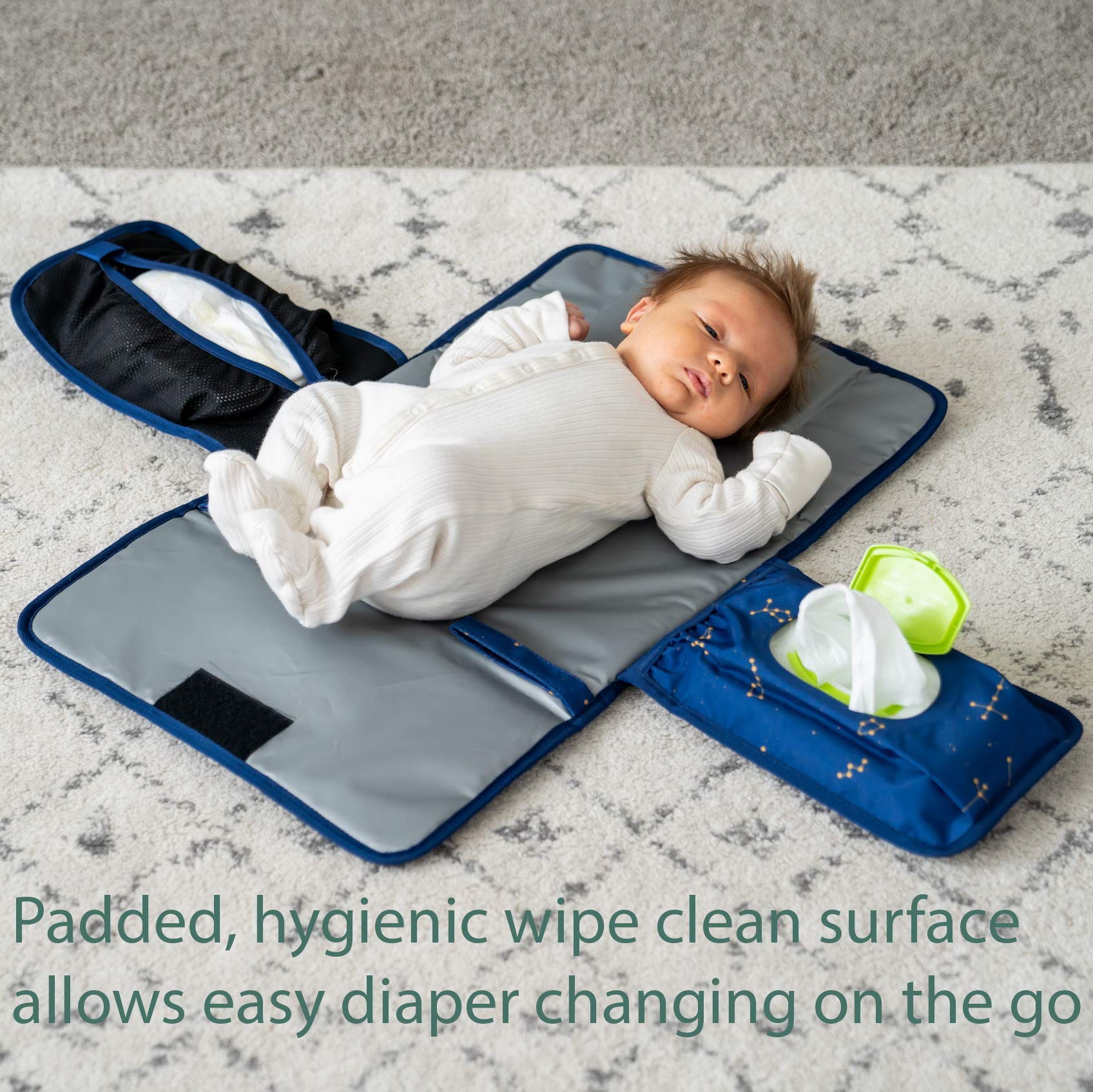 Lil Fox changing pad open, showcasing the cushioned surface for baby comfort.