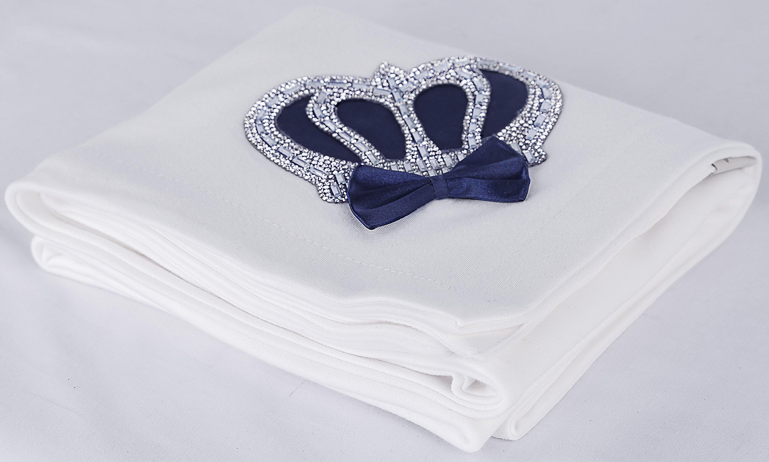 Lilax navy swaddle blanket wrapped around newborn during nap time