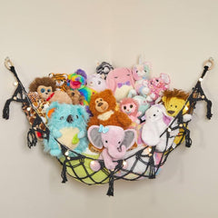 Lilly's Love macrame hammock with lights organizes plushies in a cozy corner.