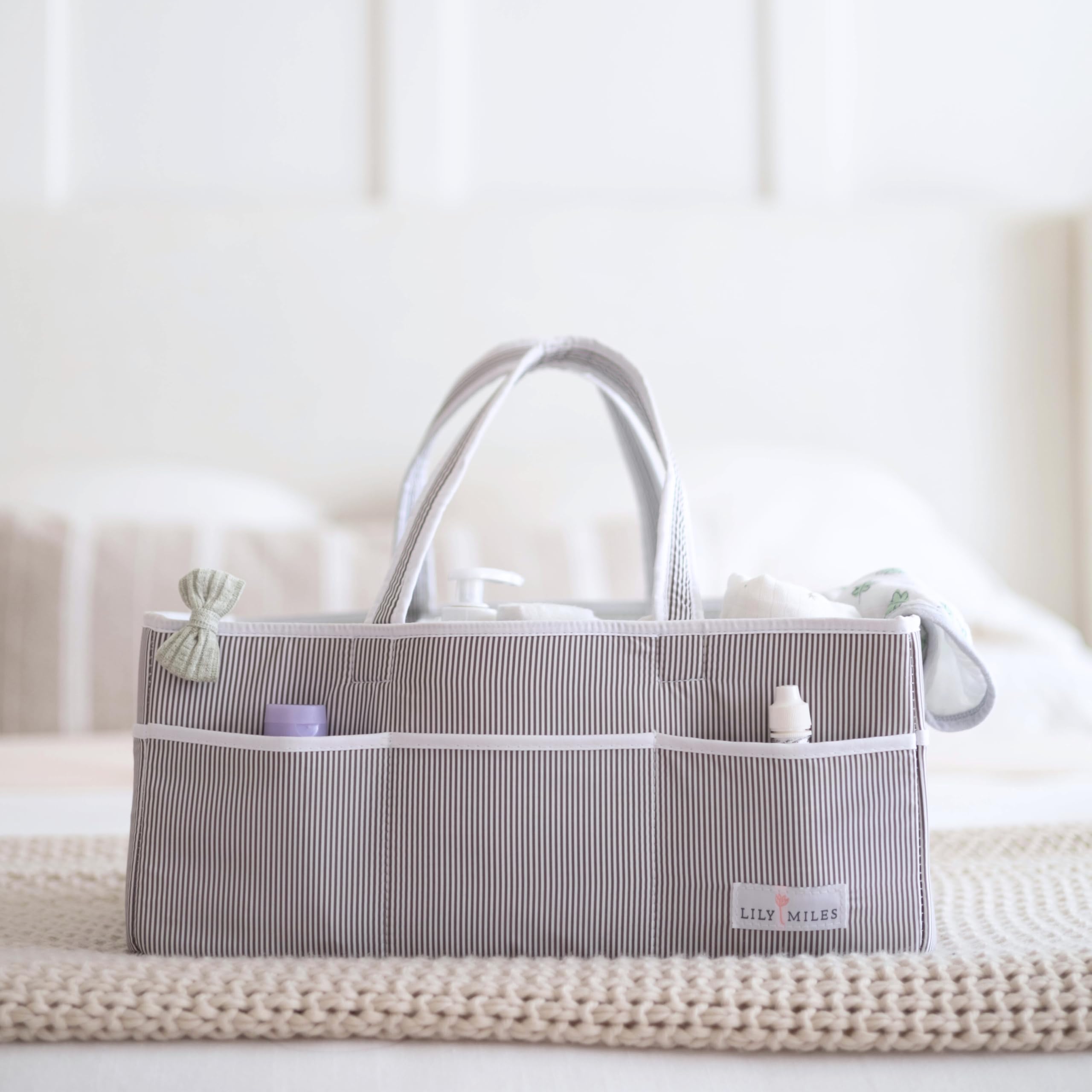 Lily Miles foldable, travel-friendly diaper caddy for easy packing.