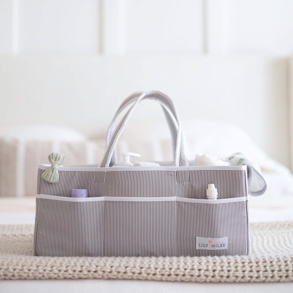 Lily Miles foldable, travel-friendly diaper caddy for easy packing.