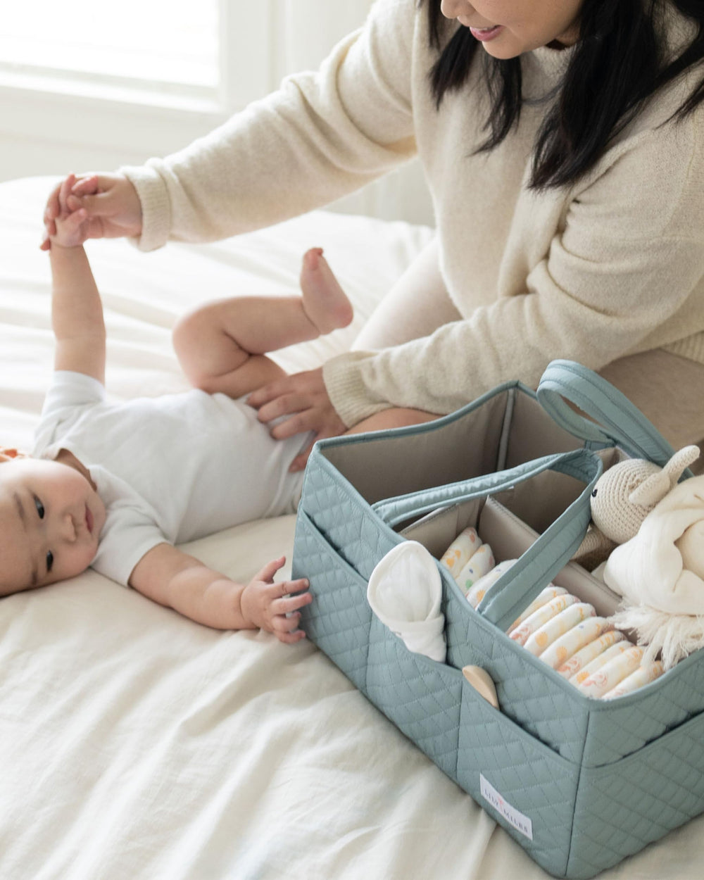 Lily Miles baby essentials storage keeps bottles, creams, and toys tidy