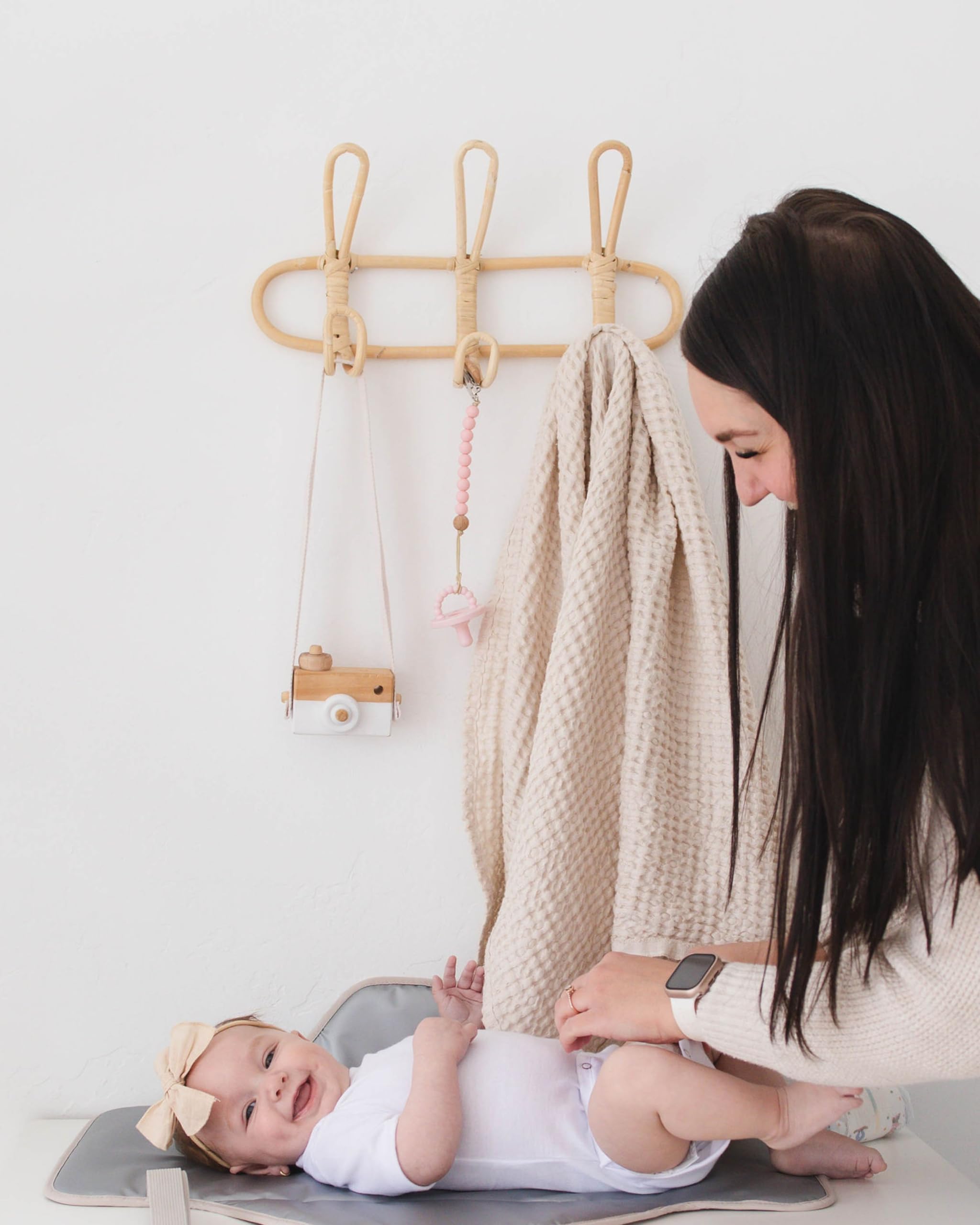 Lily Miles coordinated with diaper caddies for streamlined diaper duty.