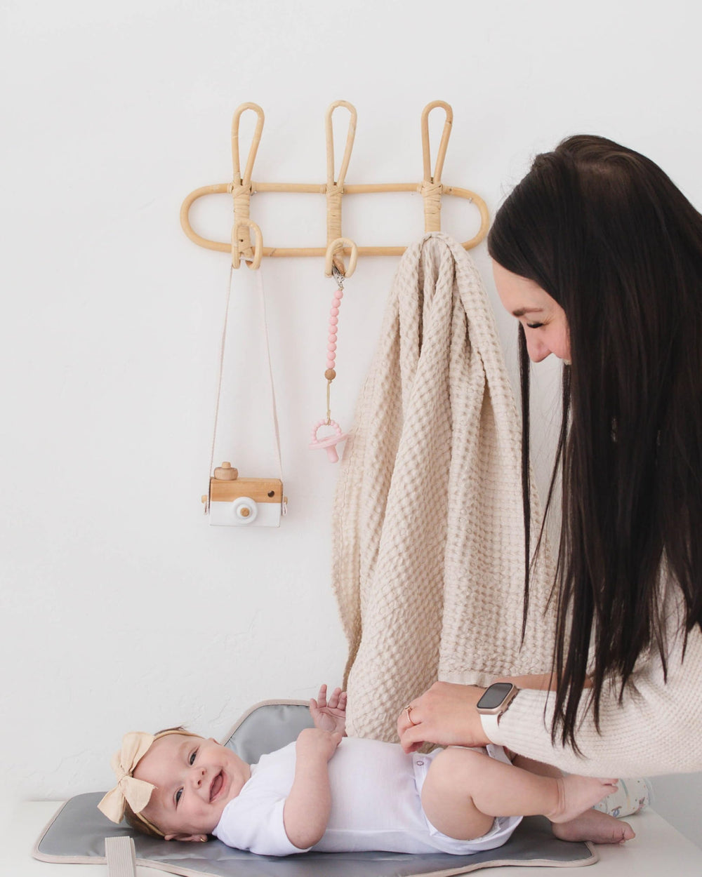 Lily Miles coordinated with diaper caddies for streamlined diaper duty.