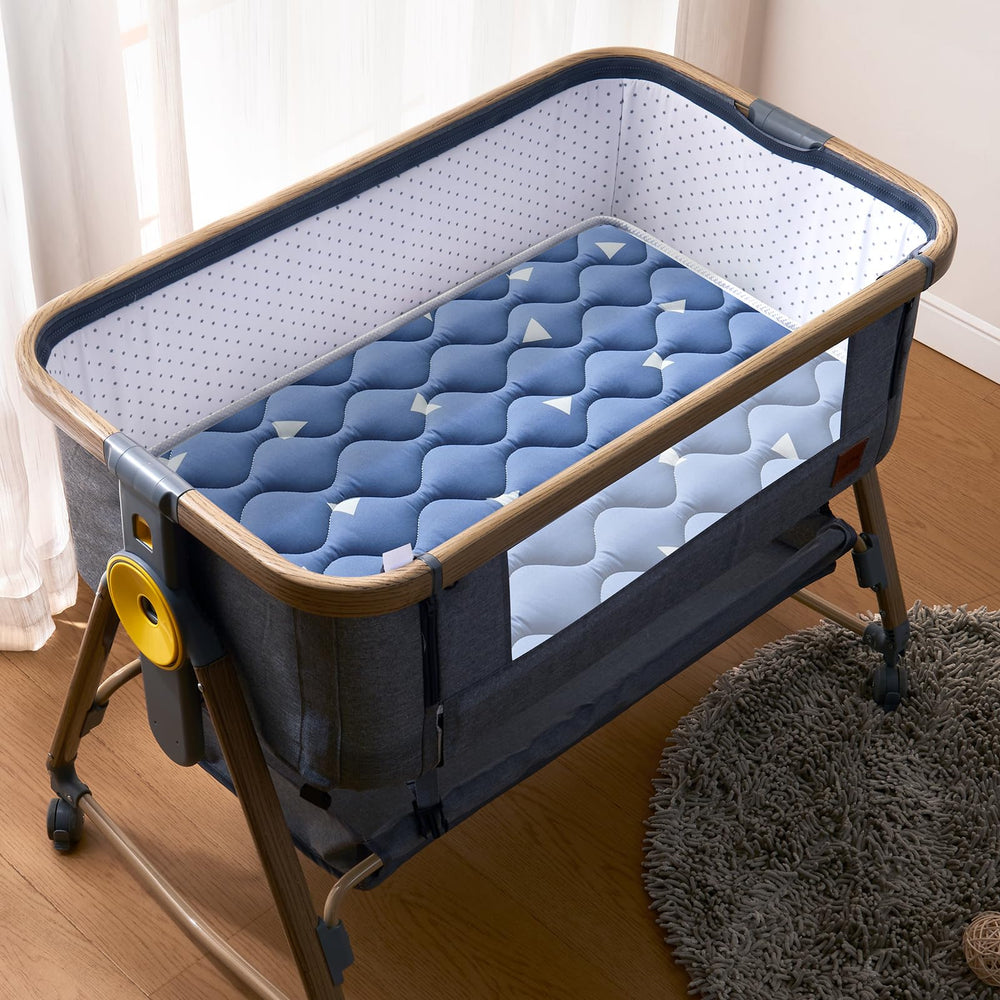 LILYVIBEBEARHAPPY bassinet mattress back view shows waterproof surface for spills.