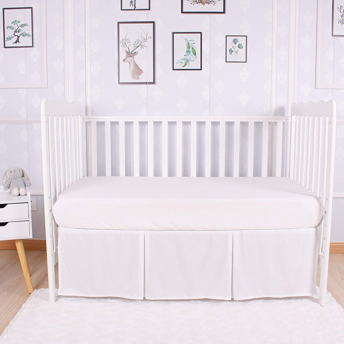 Linens Limited box pleated crib bed skirt adds a tailored nursery look.
